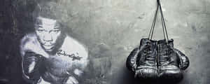 Caption: Boxing Legend Emile Griffith With His Gloves On Wallpaper