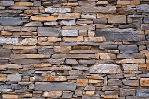 Caption: Captivating Hi-res Texture Of A Stone Wall Wallpaper