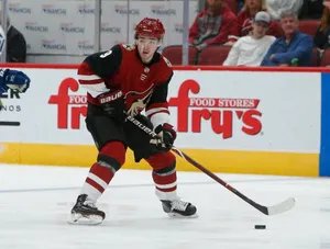 Caption: Clayton Keller In Action Against Vancouver Canucks Wallpaper