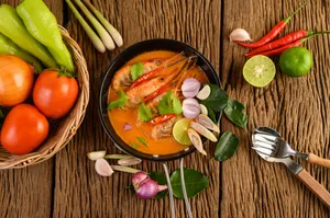 Caption: Delectable Thai Cuisine - Tom Yum Soup Wallpaper