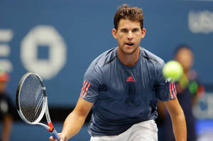 Caption: Dominic Thiem - Focused Tennis Star In Action Wallpaper