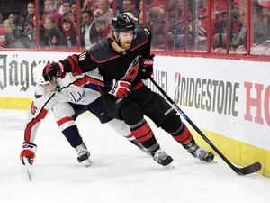 Caption: Dougie Hamilton In Action Against Andre Burakovsky Wallpaper