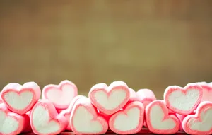 Caption: Enchanting 3d Marshmallow Hearts Lined Up In Perfect Harmony Wallpaper