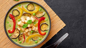 Caption: Exquisite Green Vegetarian Thai Curry With Tofu Wallpaper