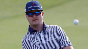 Caption: Famed Golfer Zach Johnson In Action Wallpaper