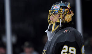 Caption: Ice Warrior: Marc-andré Fleury Of The Vegas Golden Knights Wallpaper