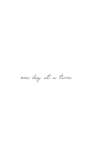 Caption: Inspiring Black And White Quote - One Day At A Time Wallpaper