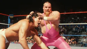 Caption: Intense Showdown Scene: Sid Vicious And Jim Neidhart Wrestling Wallpaper