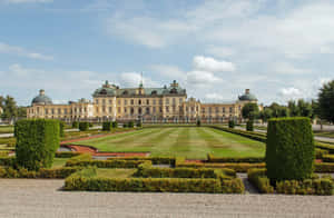 Caption: Majestic View Of Drottningholm Palace, Sweden. Wallpaper