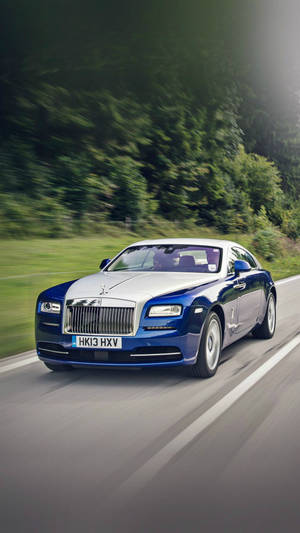 Caption: Opulence On Wheels - A Stunning Blue And White Rolls Royce Wallpaper