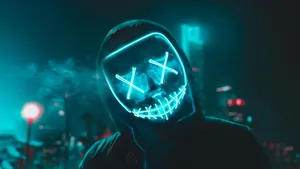 Caption: Radiant Neon Mask In The Dark Wallpaper
