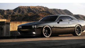 Caption: Roaring Power - Dodge Challenger On The Road Wallpaper