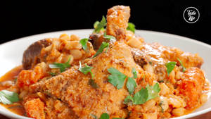 Caption: Sumptuous Chicken Cassoulet With Parsley Garnish Wallpaper