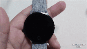 Caption: Trendy Smartwatch On A Wooden Surface Wallpaper