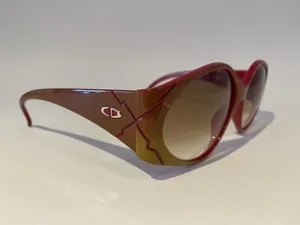 Caption: Vintage Elegance With Christian Dior Sunglasses Wallpaper