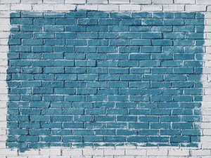 Captivating Blue Paint On A Brick Wall Wallpaper