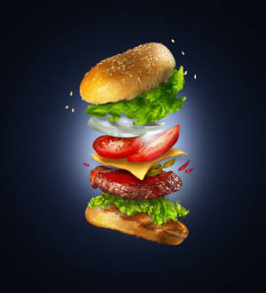 Captivating Floating Cheeseburger Photography Wallpaper