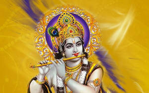 Captivating Image Of Yellow-based Lord Krishna With His Flute Wallpaper