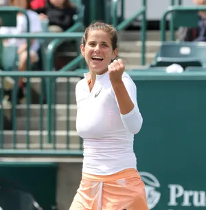 Captivating Smile Of Julia Goerges In Action Wallpaper