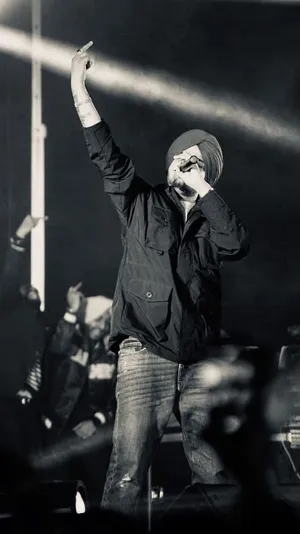 Captivating Snapshot Of Sidhu Moose Wala Energizing The Audience Wallpaper