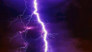 Capture The Beauty Of The Lightning In The Night Sky Wallpaper