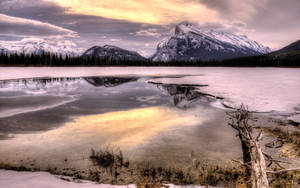 Capture The Moment Of Stunning Beauty Of Snow-covered Mountains Wallpaper