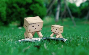 Cardboard Box Robots Reading Book Wallpaper