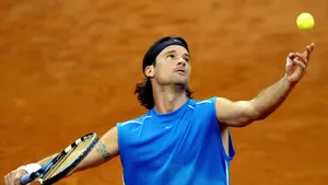Carlos Moya Expertly Delivering A Tennis Serve Wallpaper