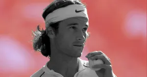 Carlos Moya Showcasing His Tennis Skills In Black And White. Wallpaper