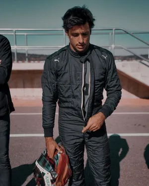 Carlos Sainz Jr Black Racing Suit Wallpaper