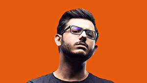 Carryminati Portrait With An Orange Background Wallpaper