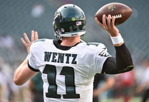 Carson Wentz Tossing Ball Nfl Wallpaper