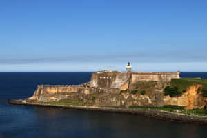 Castillo San Felipe Del Morro And Calm Sea Wallpaper