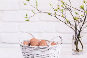 Celebrate Easter With These Beautiful Brown Eggs In A Colorful Basket! Wallpaper