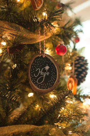 Celebrate The Charm Of Christmas With Hope & Happiness Wallpaper