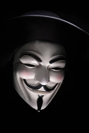 Celebrate The Spirit Of Anonymous With The Famous Guy Fawkes Mask Wallpaper