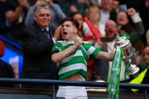 Celebrating Kieran Tierney With Trophy Wallpaper