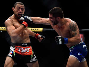 Chad Mendes Throwing A Punch Wallpaper