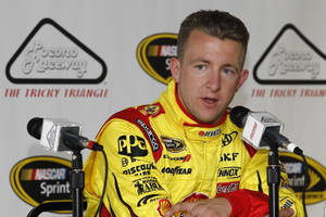 Champion Car Racer, Aj Allmendinger, Keenly Answering Journalist Queries. Wallpaper