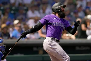 Charlie Blackmon In Action, Swinging His Bat During A Game. Wallpaper