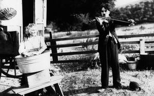 Charlie Chaplin Playing The Violin Wallpaper