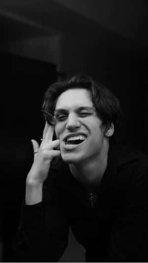 Chase Hudson Looking Up At The Night Sky Wallpaper