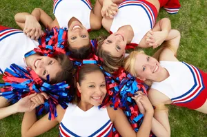 Cheerleading On Grass Wallpaper