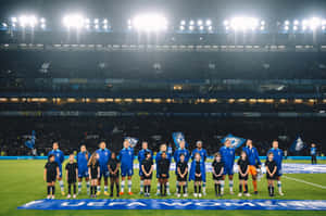 Chelsea Women's Team Pose For A Photo At The Stadium Wallpaper