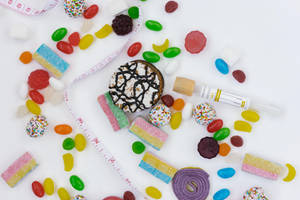 Chewy Sweets And A Measuring Tape Wallpaper