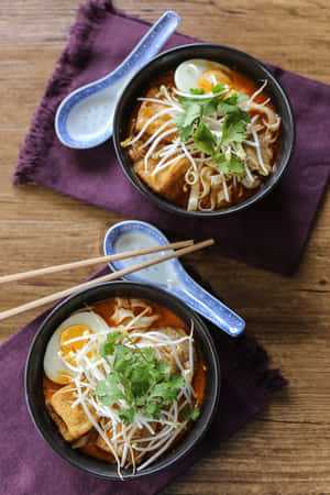Chicken Curry Laksa On Purple Table Napkin Wallpaper