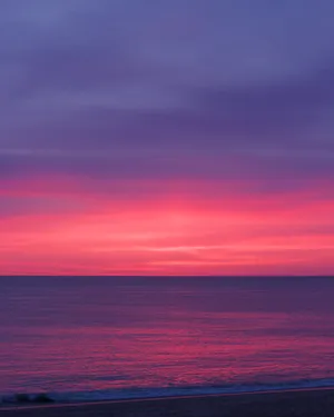 Chill Pink Sunset By Beach Wallpaper