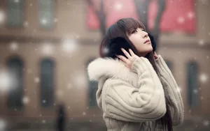 Chinese Woman With Earmuffs Wallpaper