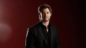 Chris Hemsworth In A Black Formal Outfit Wallpaper