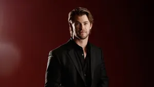 Chris Hemsworth In A Black Formal Outfit Wallpaper